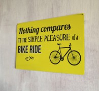 Simple pleasure of a bike ride metal sign